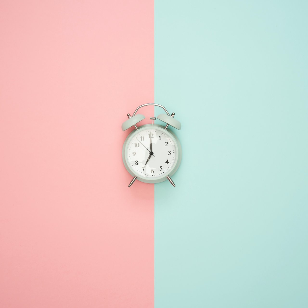 Clock on coloured background.