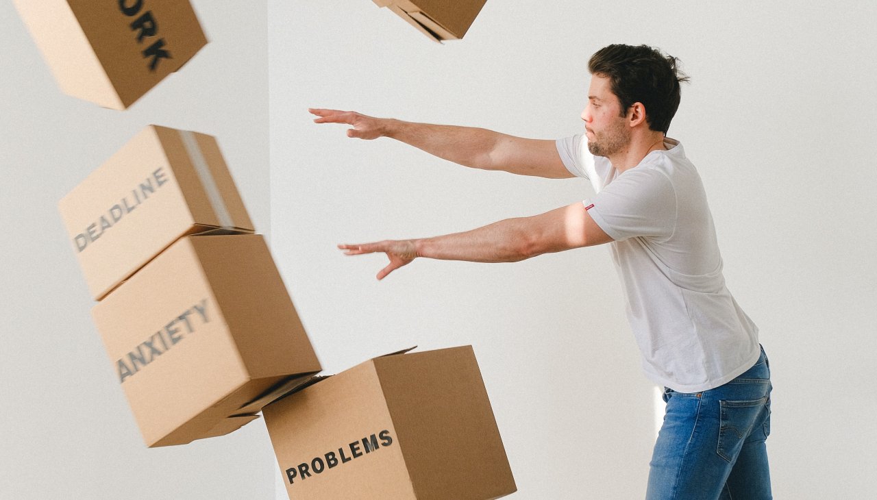 Man pushing boxes away. Each box has a title: Deadline, anxiety and problems.